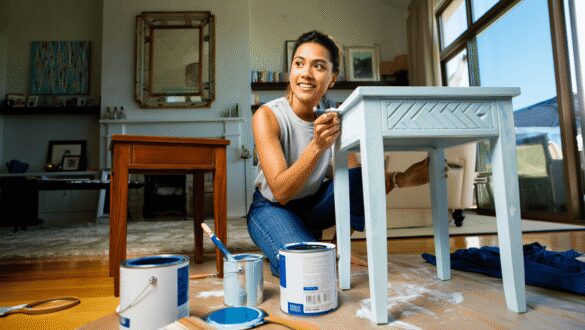 dining room with affordable DIY upgrades like wall trim, wallpaper, and a ceiling medallion 