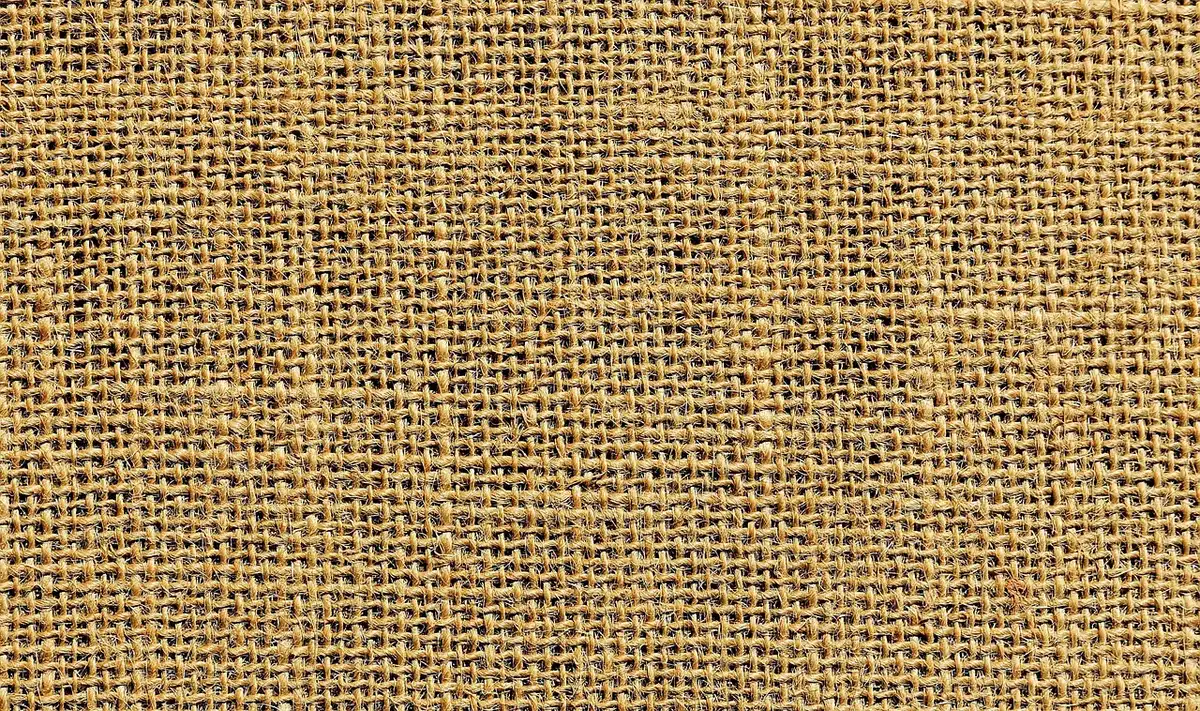 Gros plan sur la texture et le tissage d'un tissu denim indigo